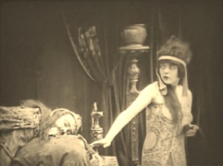 She induces Holofernes to a state of drunken stupor . . .