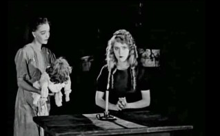 Becky approaches with Sara's doll, thrown to the floor by the Matron.